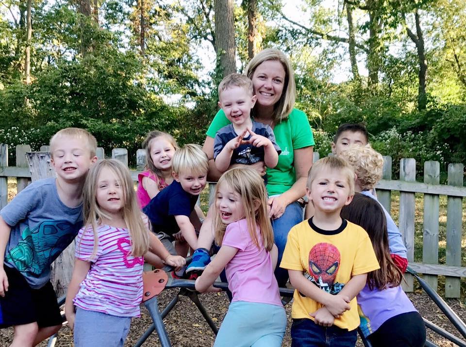 Teacher interacting with a child at Serendipity Child Care Center